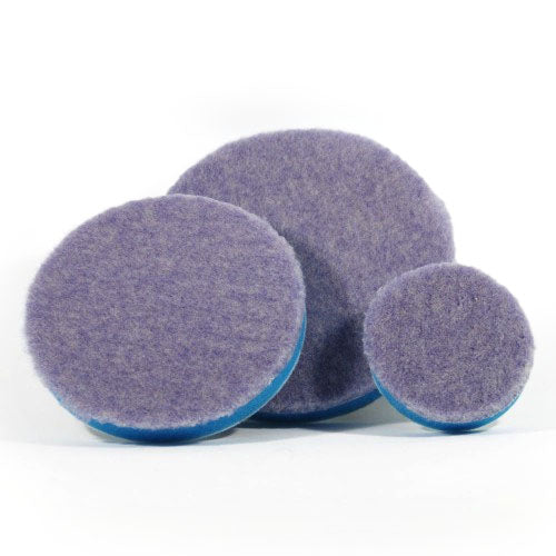 Product photography featuring three circular purple felt polishing pads with blue foam backing in varying sizes on a clean white studio background
